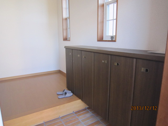 Entrance. Plenty of shoe box. It is bright and spacious entrance.