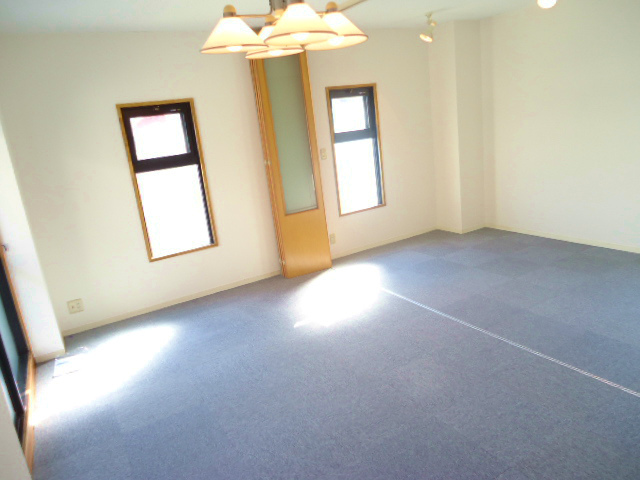 Other room space. There is a window is bright