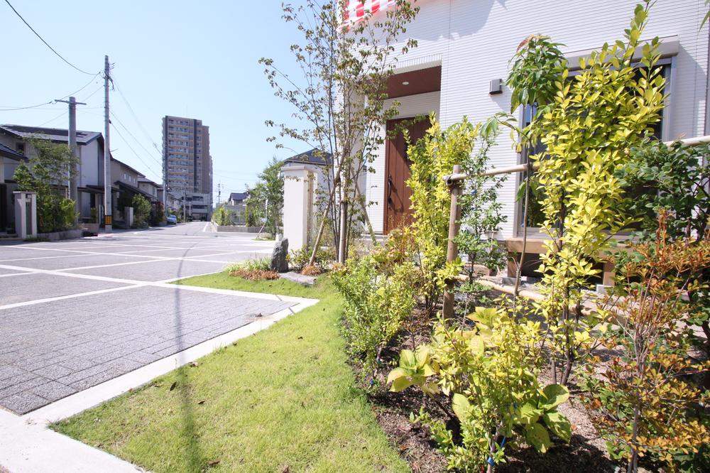 Local appearance photo. Trees effectively place the, It has a lush outside structure building.