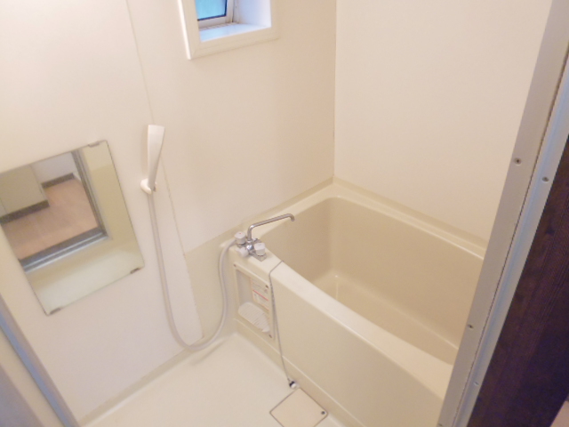 Bath. There is a window in the bathroom