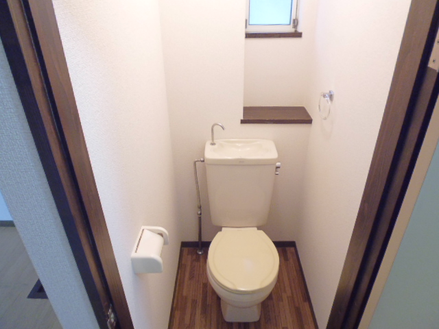 Toilet. There is a window in the toilet