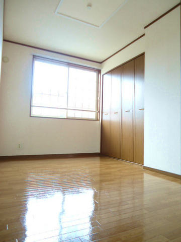 Living and room. It is bright because there is a window