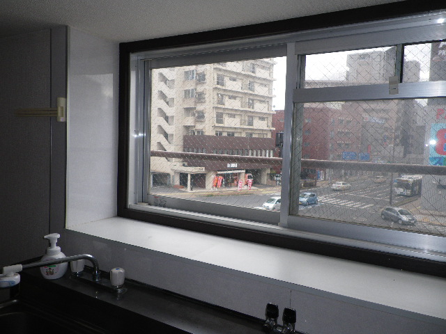 Kitchen. It is bright because there is a window in the kitchen!