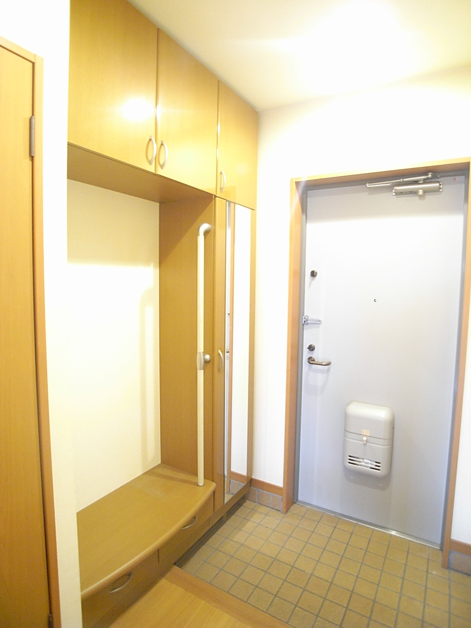 Entrance. Bench with shoes sitting is drain off