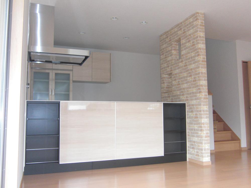 Living. Kitchen back side with little storage space. It can also be used as an interior place and small ornamental plants