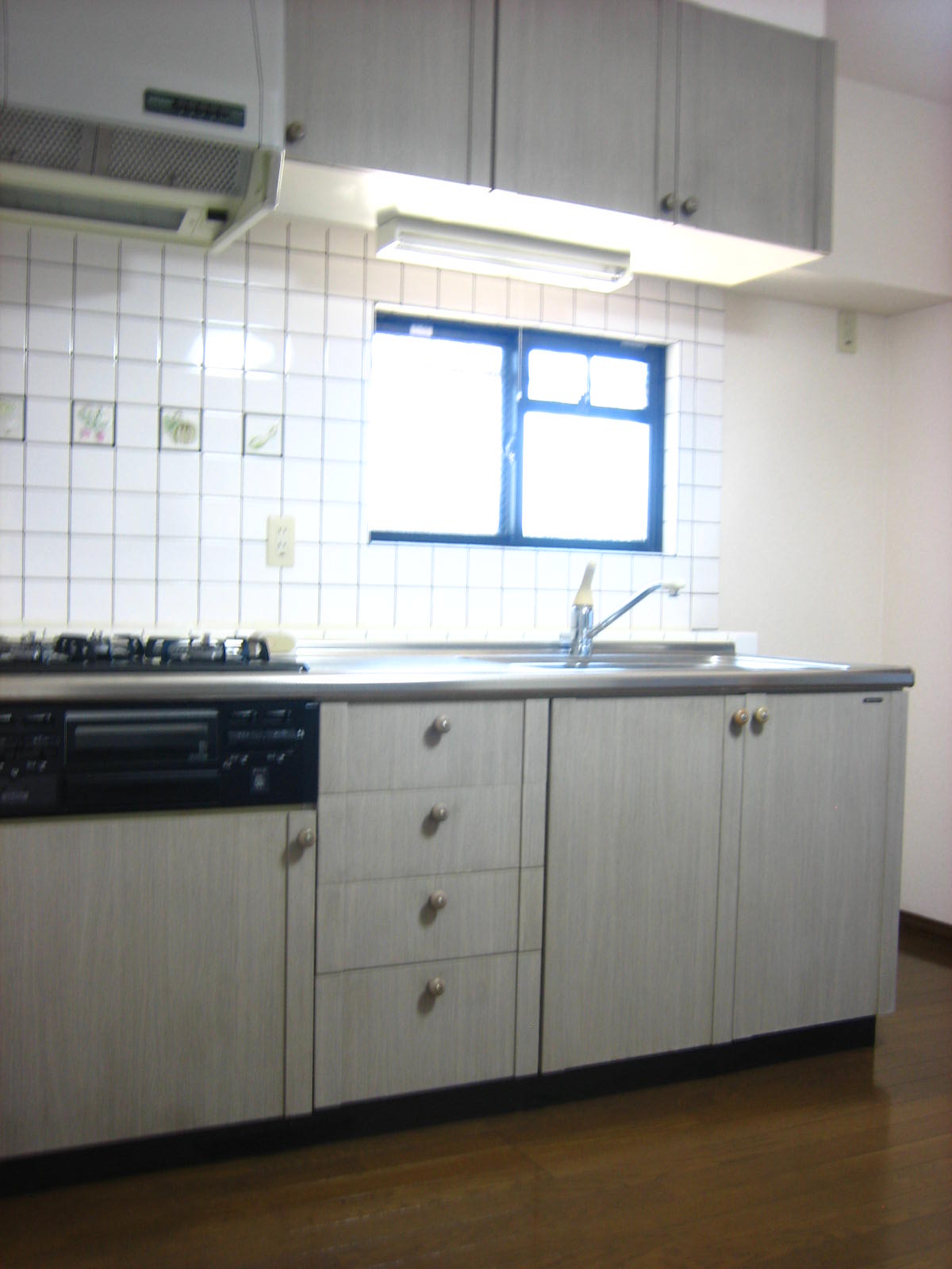 Kitchen. There is a window in the kitchen in the corner room