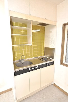 Kitchen. It is with an electric stove.