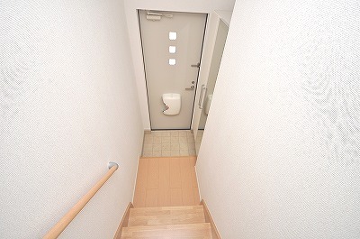 Entrance. Staircase with a handrail