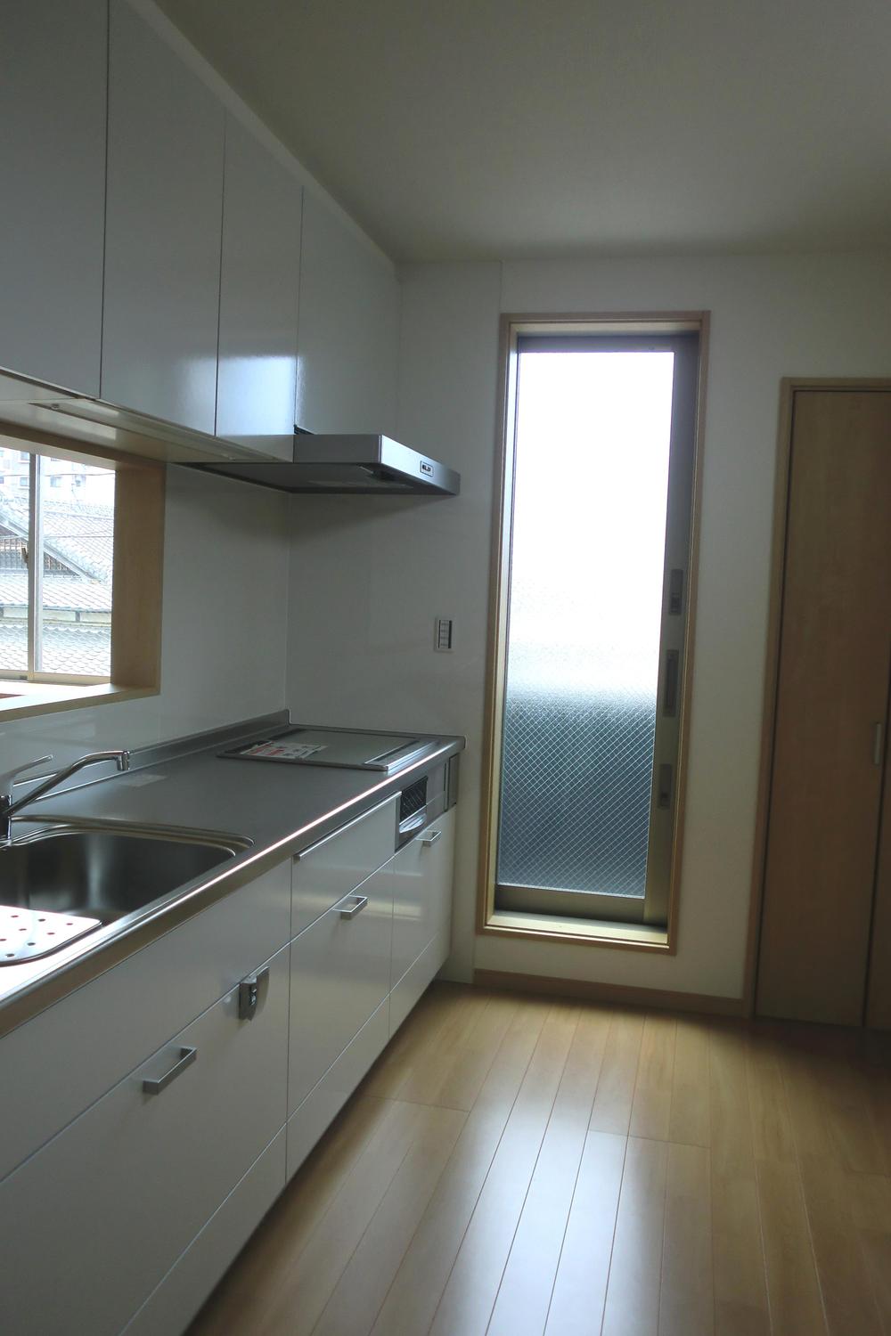 Kitchen. Back door, There is also a pantry.