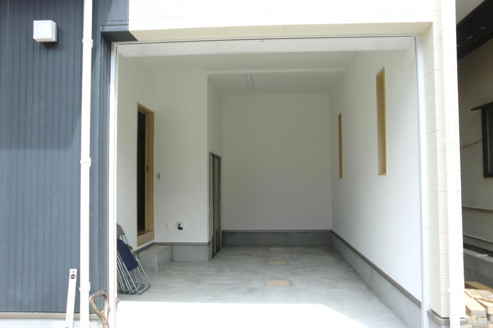 Parking lot. There is also a storage space in the garage with a shutter.