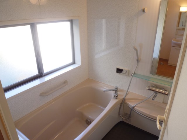 Bath. There is a large window in the bath