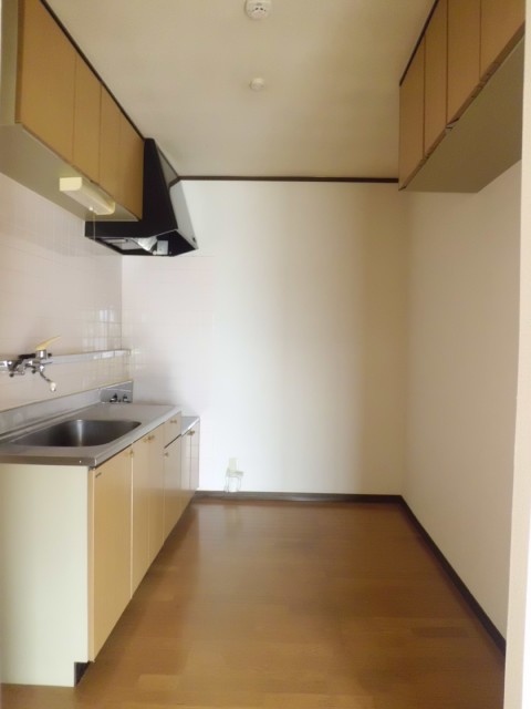 Other room space. Another angle of the kitchen.