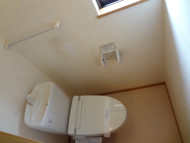 Toilet. There is a window in the toilet