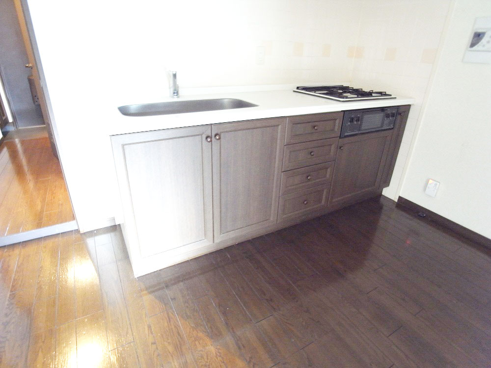 Kitchen. System kitchen adopted with a 3-burner stove and grill