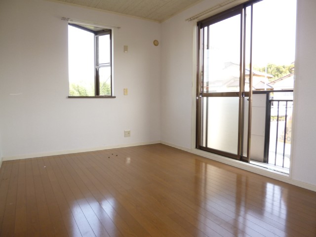 Other room space. It is bright with many windows