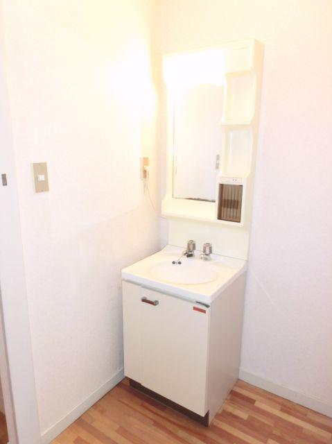 Washroom. It is a wash basin with a happy woman. 