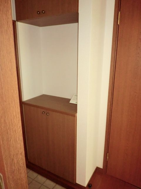 Entrance. This shoe cupboard which is divided into upper and lower.