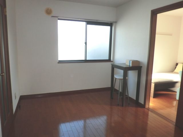 Living and room. There is also a desk and chair.