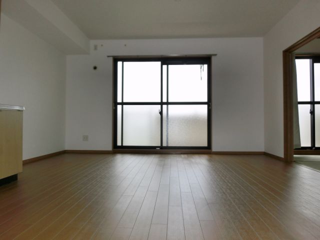 Living and room. Living room window and there is a greater sense of openness!