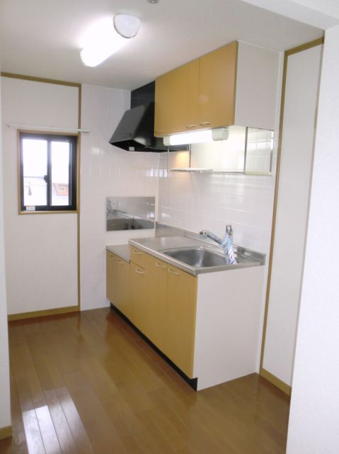 Kitchen. Bright kitchen space has a window. 