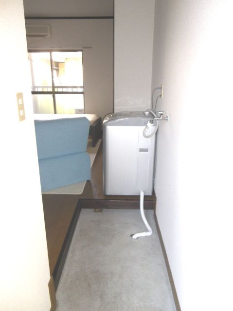 Other room space. There is a washing machine yard in the room.