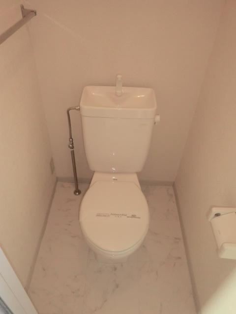 Toilet. It comes with a towel rack
