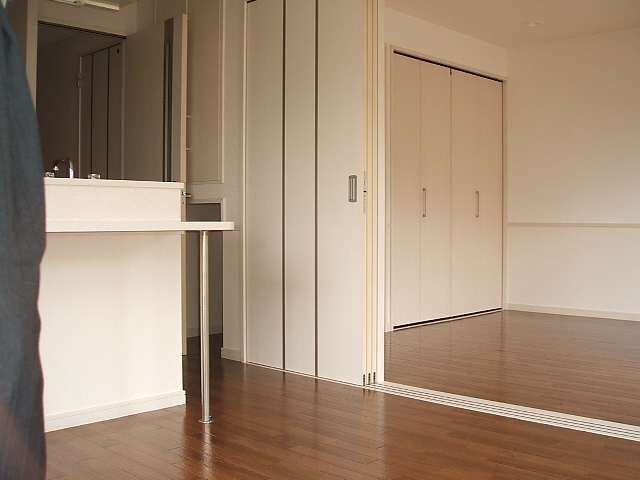 Living and room. It is counter type of kitchen.