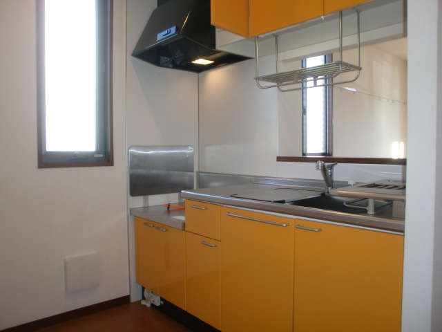 Kitchen. Kitchen panel of orange mirror finish of