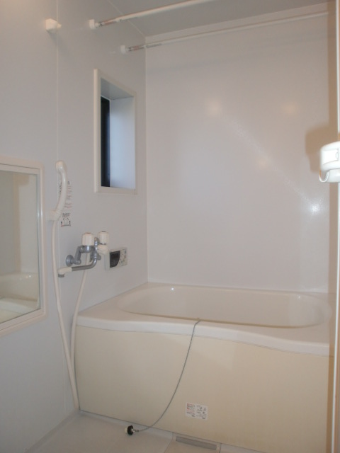 Bath. Clean unit bus, It has a small window.