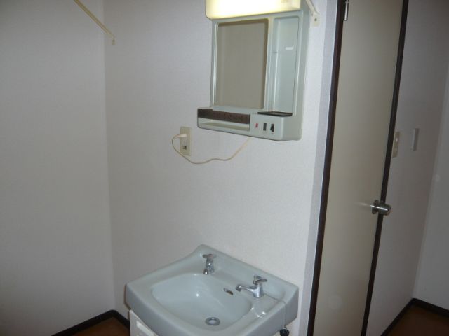 Washroom. It comes with a wash basin.