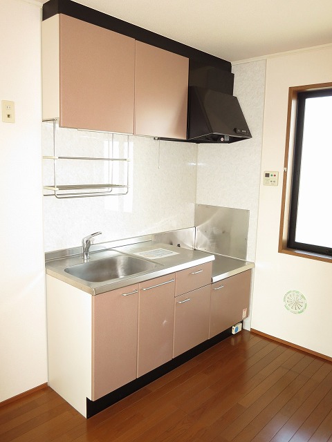 Kitchen. Bright has a window in the kitchen.