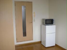 Living and room. refrigerator, It is with microwave