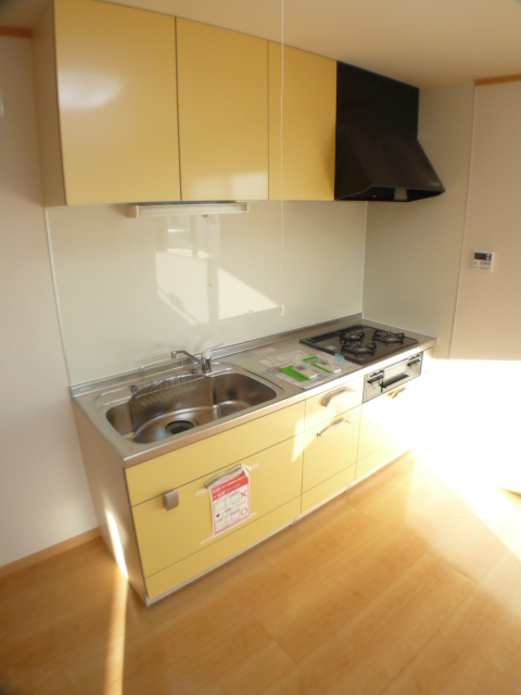 Kitchen. It is refreshing yellow of the system kitchen