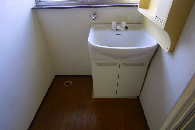 Washroom. Washing machine in the room