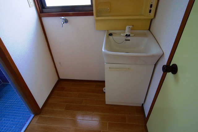 Washroom. Washing machine in the room