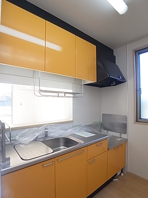 Kitchen. Kitchen panel of orange mirror finish of