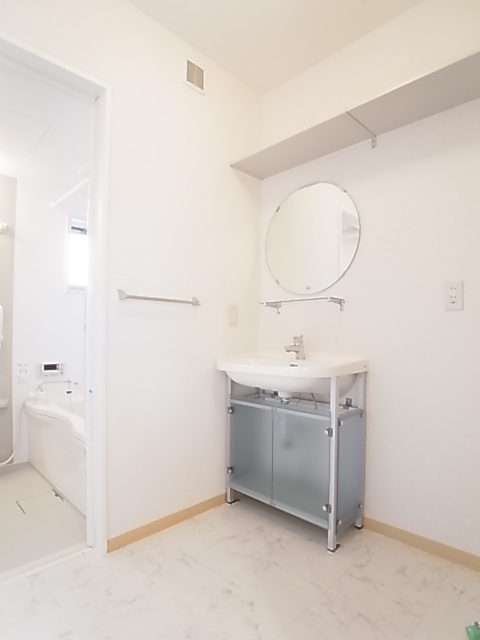 Washroom. Stylish bathroom vanity, Storage shelves at the top