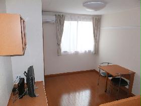 Living and room. It is a photograph that was taken from the bed top