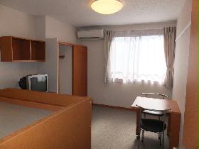 Living and room. It is a photograph taken from the entrance