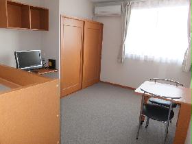 Living and room. It is a photograph that was taken from the room entrance