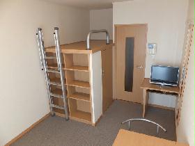 Living and room. It is a photograph that was taken from the window side