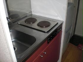 Kitchen. Two-burner stove is.