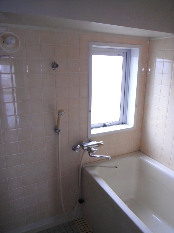 Bath. There is a window is bright. 