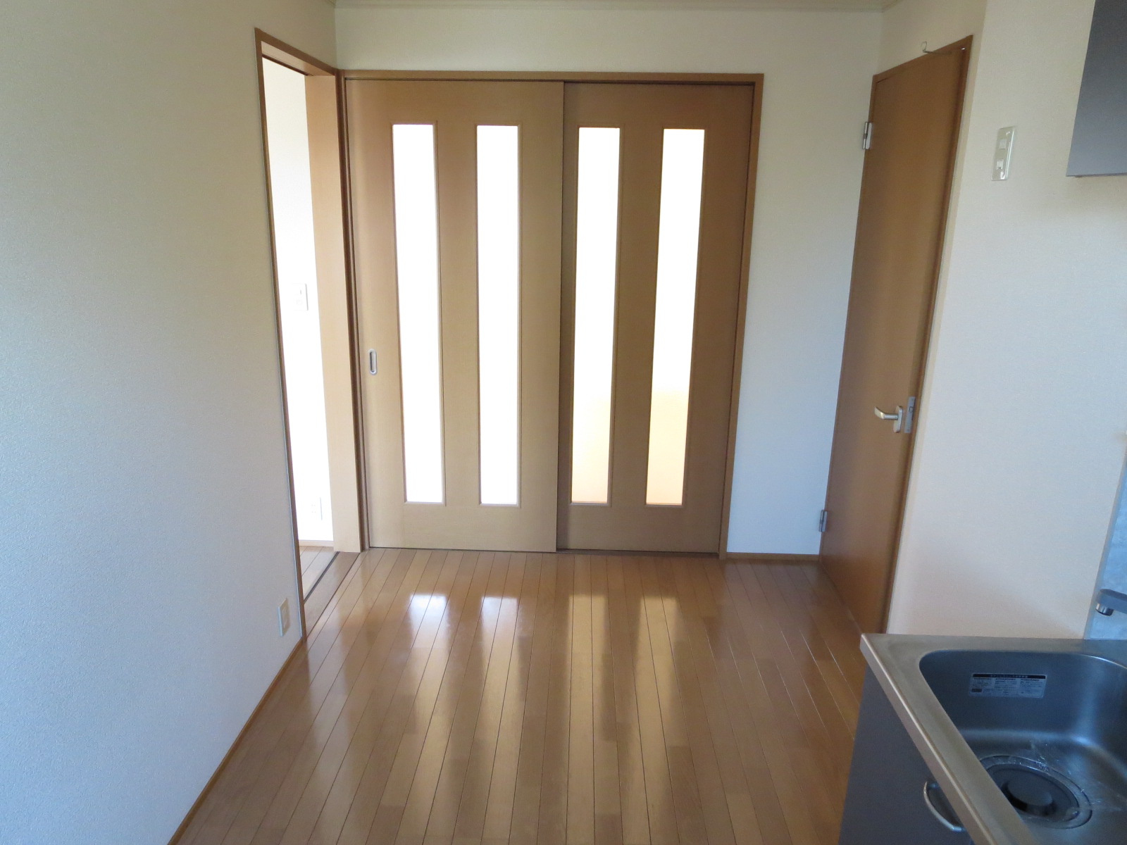 Kitchen. Double sliding door of glass filled to the south from the kitchen