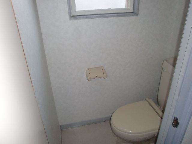 Toilet. Toilet with a small window. Useful for ventilation.