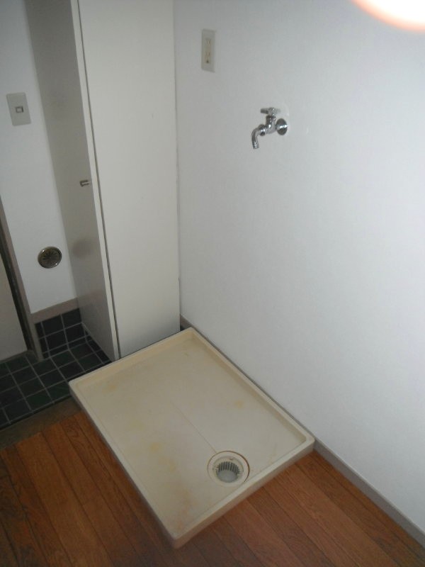 Other room space. Washing machine in the room