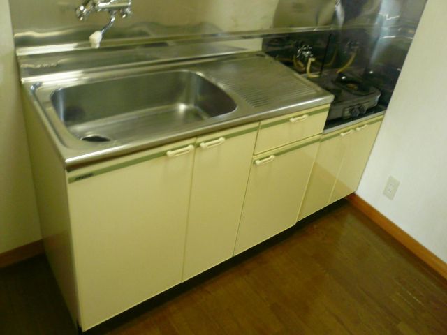 Kitchen. There ventilation fan housing and is on top of the kitchen.