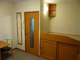 Living and room. Right-hand side, Bed bottom with making has become the storage