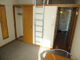 Living and room. Look in the back is, It is a closet