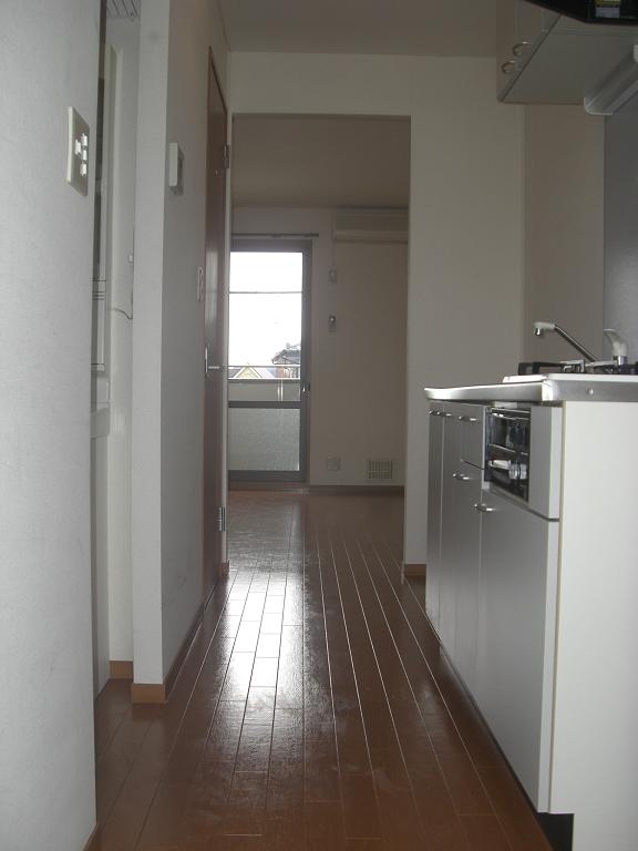 Kitchen. Photo viewing the room from the front door